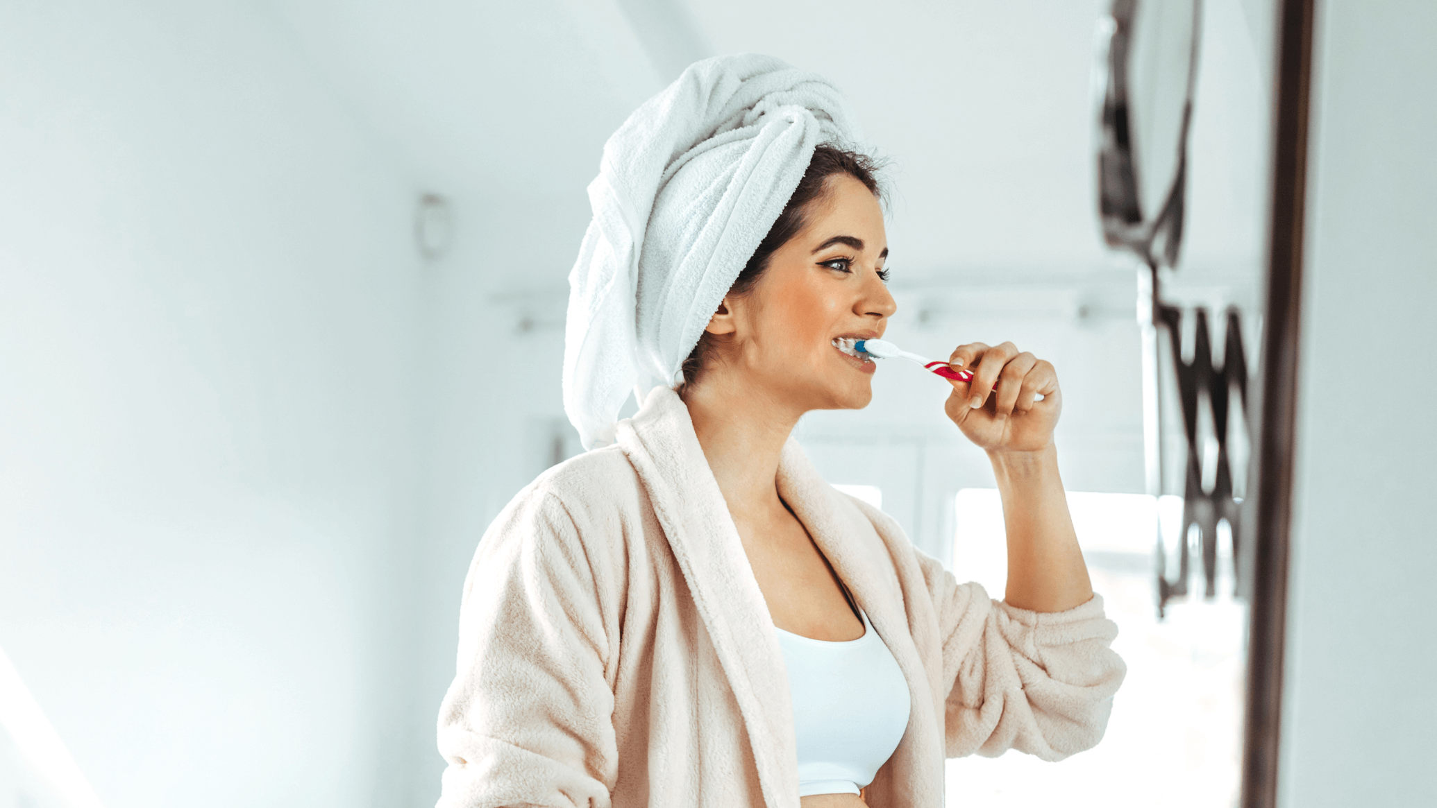 woman brushing her teeth in th